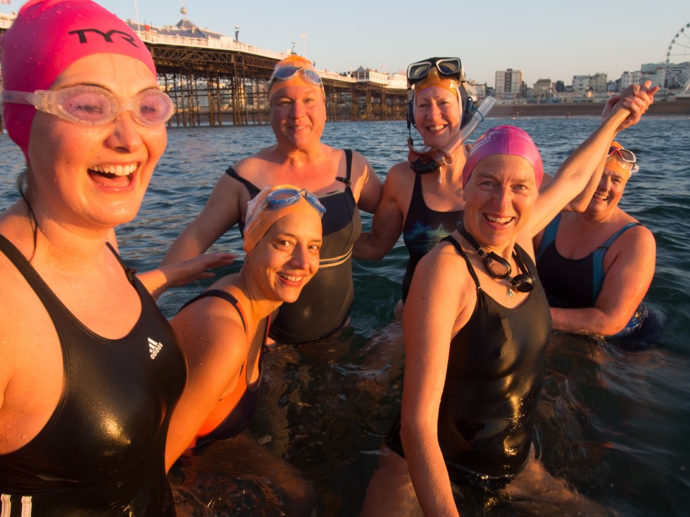 Ladies of Brighton Swimming Club standing on a sunken barge